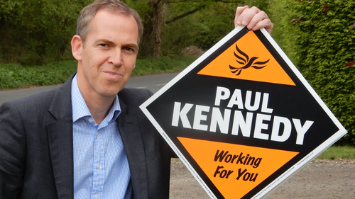 Paul Kennedy with Lib Dem stake board