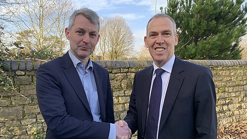 Will Forster and Paul Kennedy shaking hands