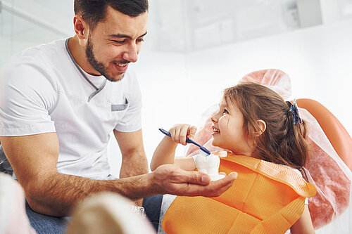 Dentist treating a young girl