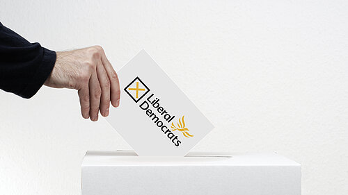 A liberal democrat ballot going into a ballot box.